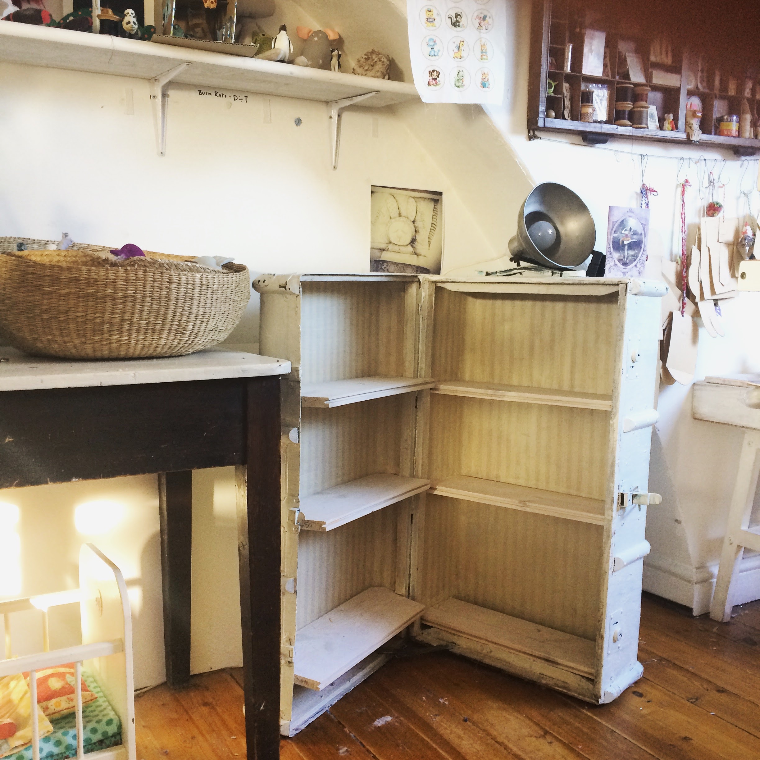 empty shelves and a basket on the table