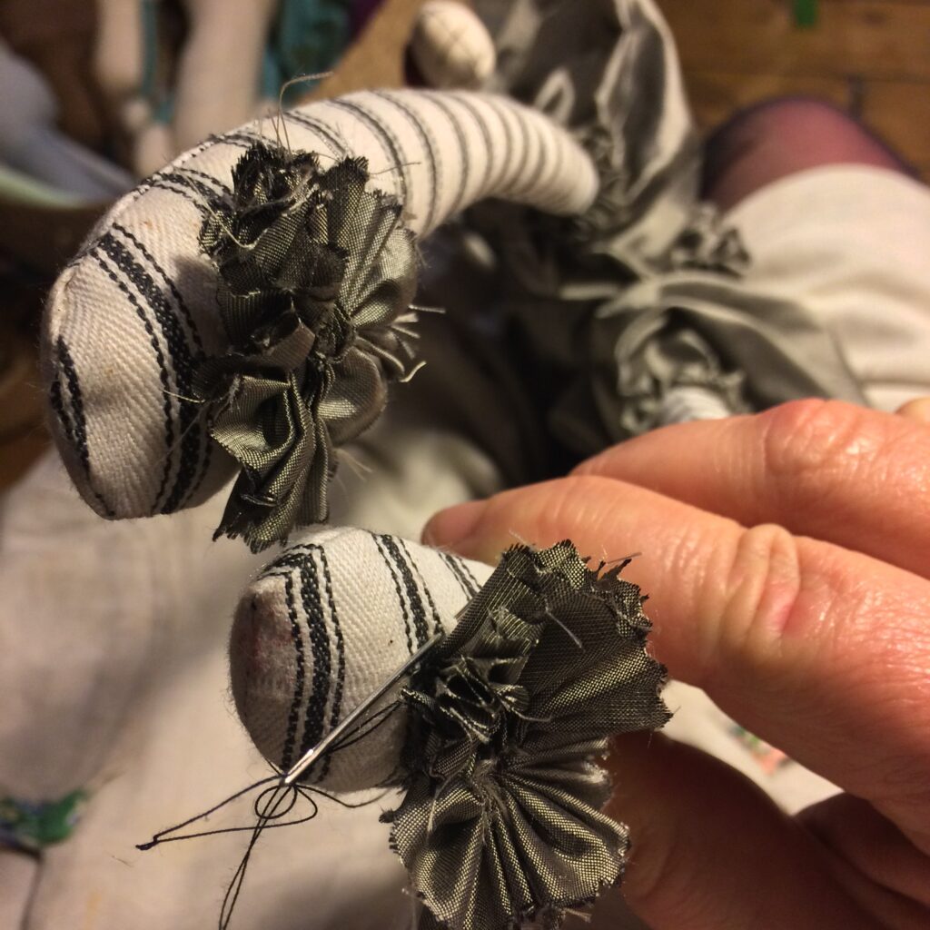 sewing details on doll legs