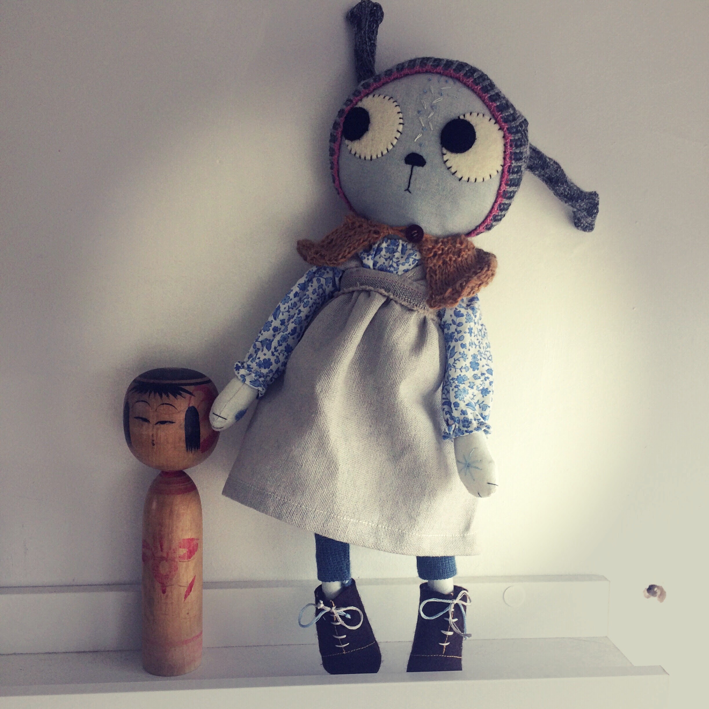 cloth cat doll with wooden doll