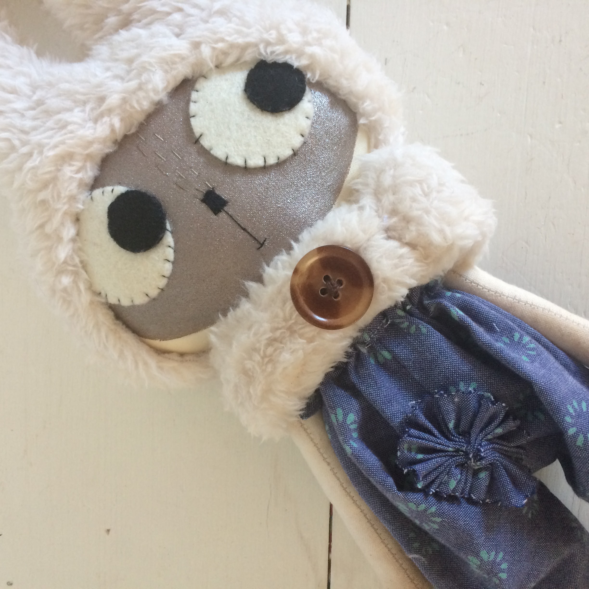 cloth doll with button
