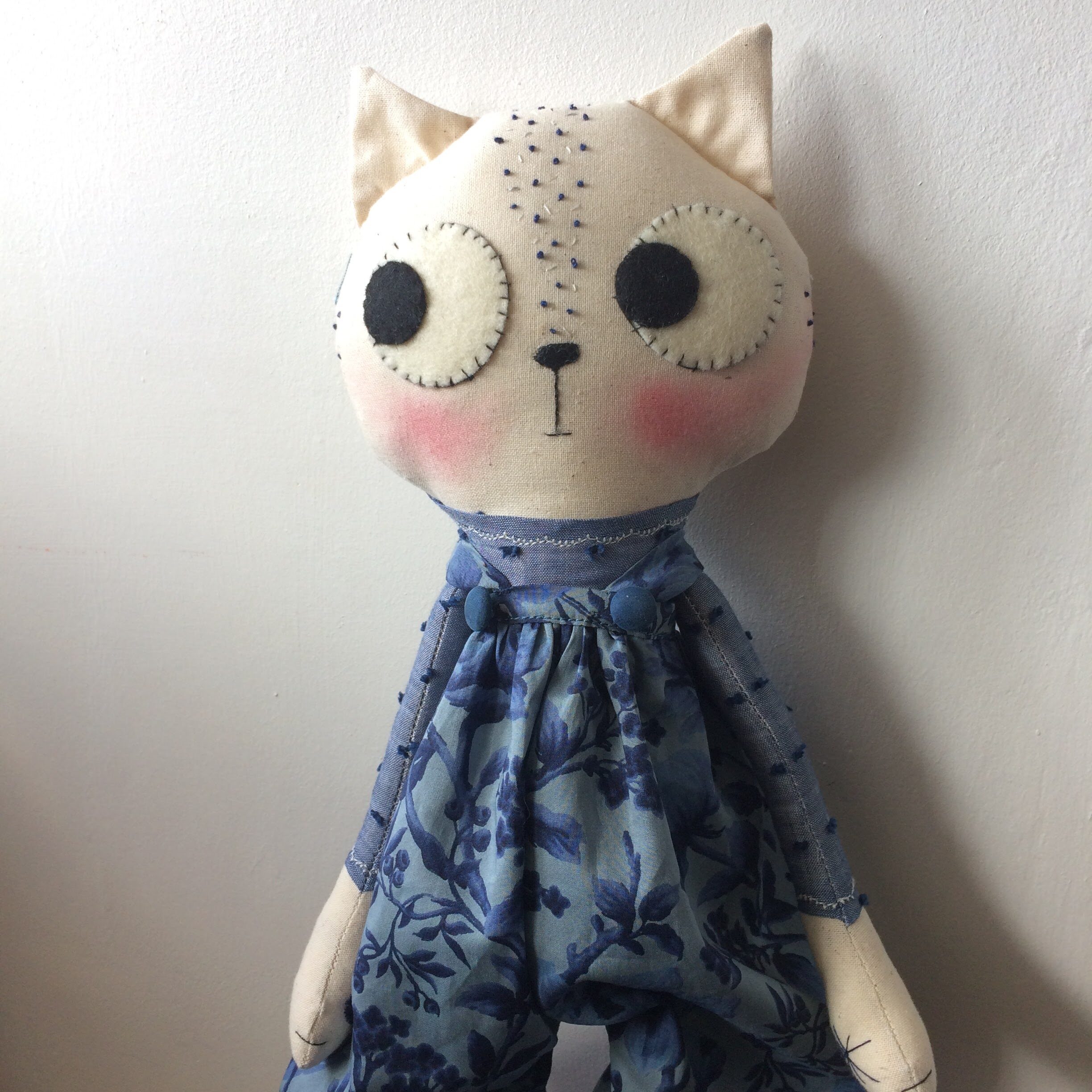 cat doll in dungarees