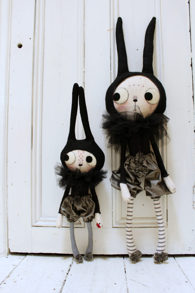 two cat dolls standing