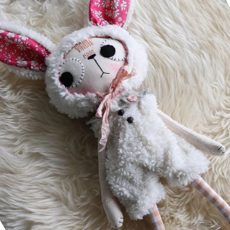 Lambkin cat doll dressed in a fluffly lamb outfir