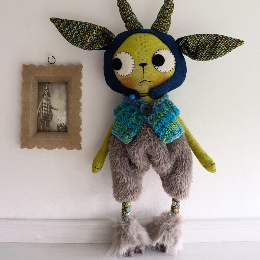 cat doll in a goat costume